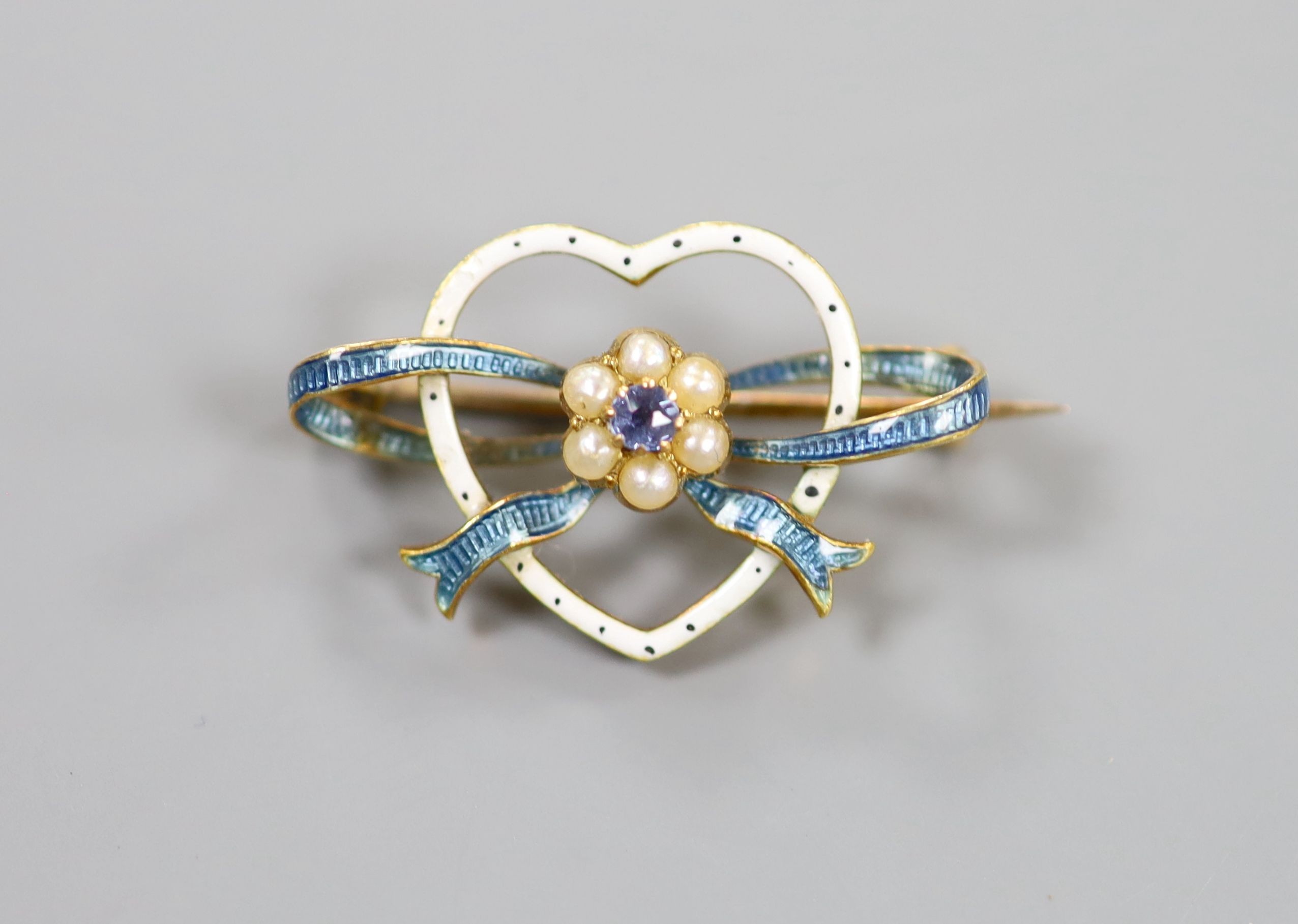 An Edwardian yellow metal, enamel, gem and seed pearl cluster set heart shaped brooch, 27mm, gross 4.3 grams.